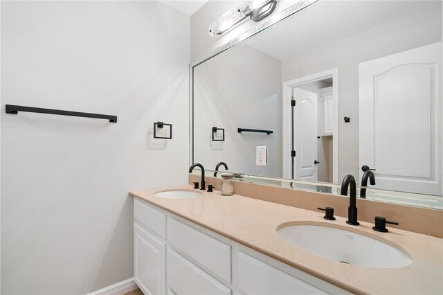 4589 Teal Dr, Corpus Christi, TX 78410 - bathroom featuring double vanity and a sink