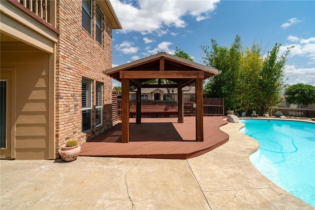 4589 Teal Dr, Corpus Christi, TX 78410 - view of swimming pool featuring a deck, a gazebo, a fenced backyard, a patio, and a fenced in pool