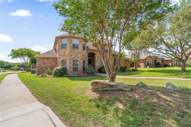 4589 Teal Dr, Corpus Christi, TX 78410 - traditional-style home featuring a front yard and brick siding