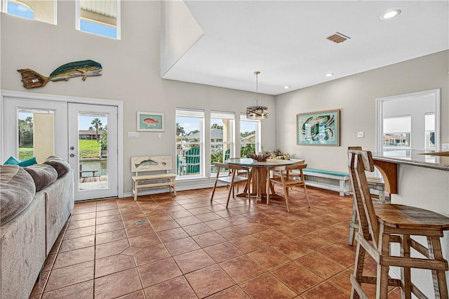 973 Pompano Dr, Aransas Pass, TX 78336 - tiled dining area with recessed lighting, french doors, and healthy amount of natural light