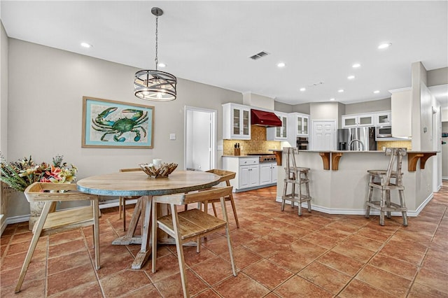 973 Pompano Dr, Aransas Pass, TX 78336 - dining room featuring recessed lighting and a chandelier