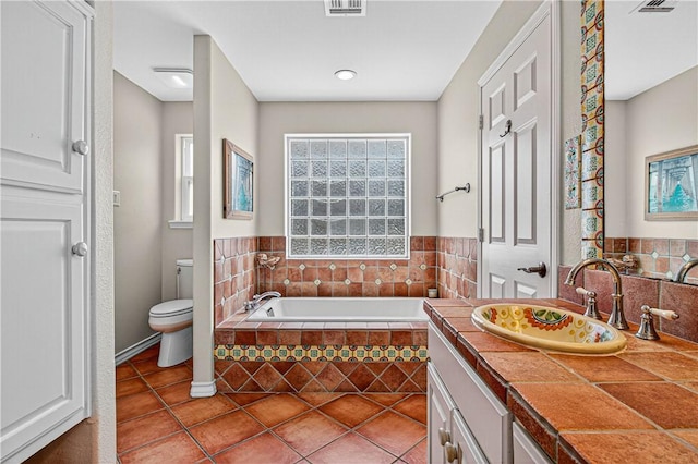 973 Pompano Dr, Aransas Pass, TX 78336 - full bathroom with a bath, vanity, and tile patterned floors