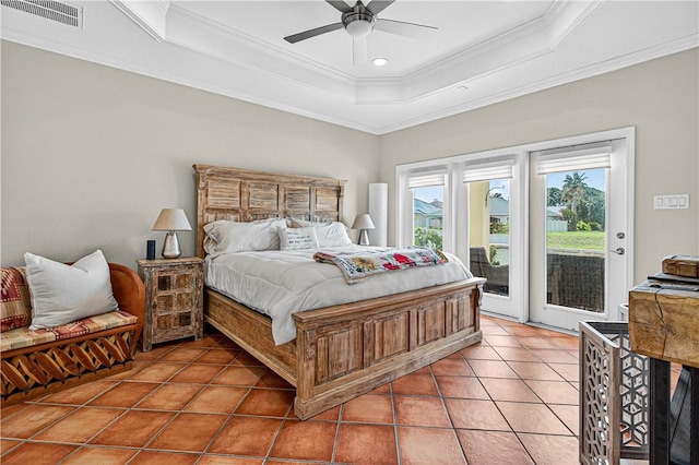 973 Pompano Dr, Aransas Pass, TX 78336 - bedroom with a tray ceiling, access to exterior, crown molding, light tile patterned flooring, and a ceiling fan
