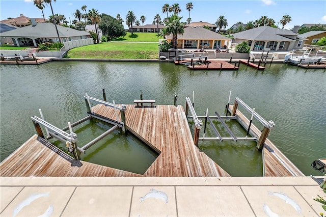 973 Pompano Dr, Aransas Pass, TX 78336 - dock area with boat lift, a water view, and a residential view