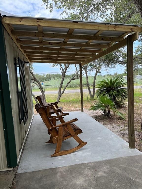 view of patio / terrace featuring fence