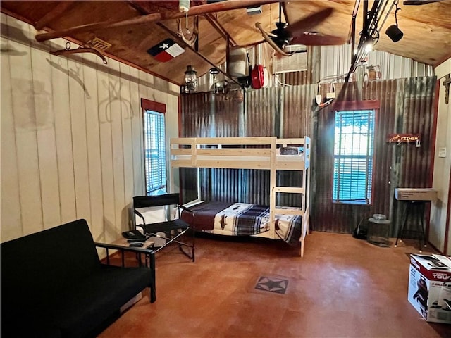 bedroom with wooden ceiling, wooden walls, and vaulted ceiling