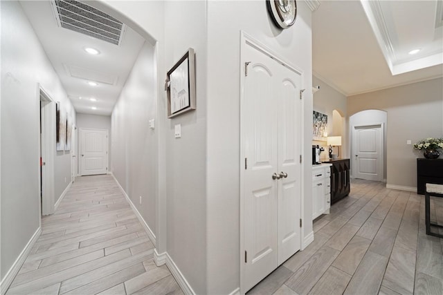 6421 Aikman, Corpus Christi, TX 78414 - corridor featuring arched walkways, wood tiled floors, baseboards, ornamental molding, and recessed lighting