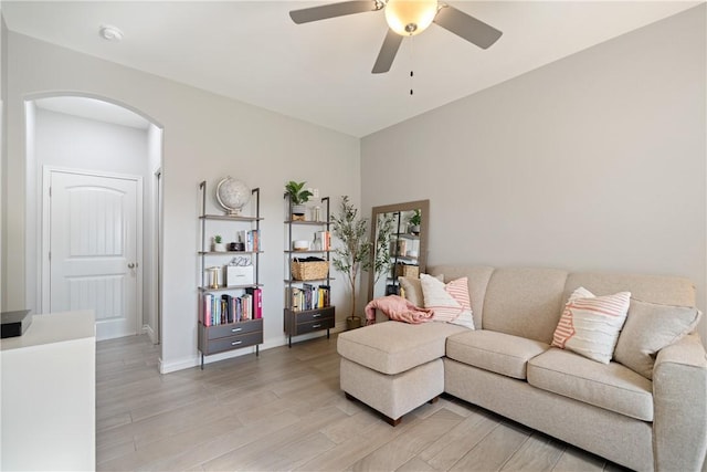 6421 Aikman, Corpus Christi, TX 78414 - living area with arched walkways, a ceiling fan, light wood-type flooring, and baseboards