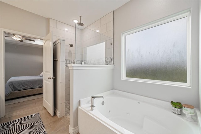 6421 Aikman, Corpus Christi, TX 78414 - bathroom with walk in shower, a whirlpool tub, connected bathroom, wood finished floors, and ceiling fan