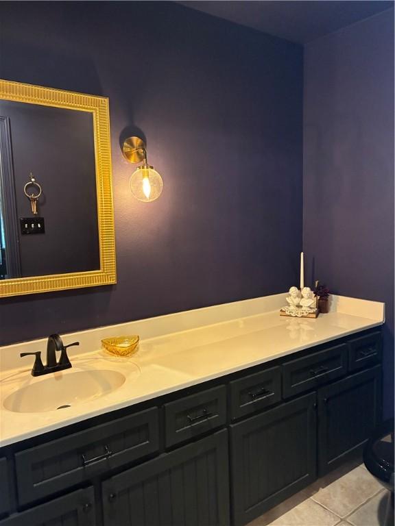 bathroom featuring tile patterned flooring and vanity