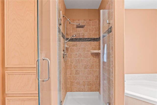 4241 Aaron Cv, Corpus Christi, TX 78413 - full bathroom with a stall shower and a bath