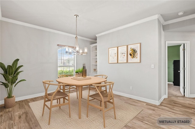 4241 Aaron Cv, Corpus Christi, TX 78413 - dining area featuring light wood finished floors, a chandelier, and ornamental molding