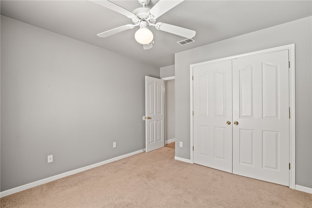 4241 Aaron Cv, Corpus Christi, TX 78413 - unfurnished bedroom featuring light colored carpet, a closet, and a ceiling fan