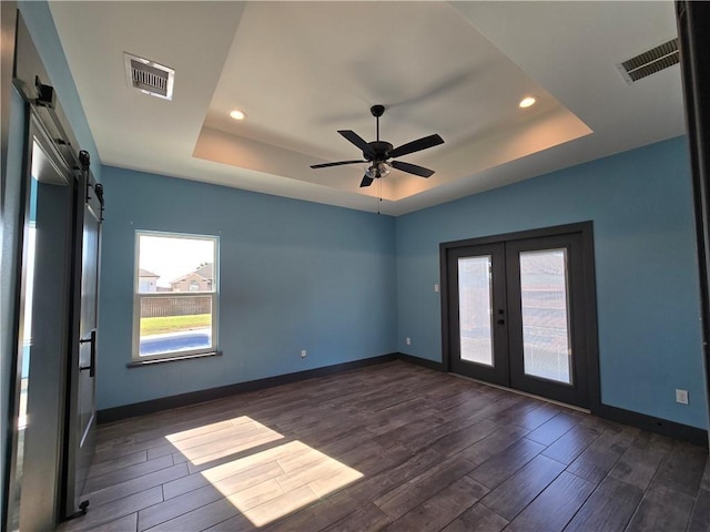 16125 Seagrape St, Corpus Christi, TX 78418 - spare room with a raised ceiling, french doors, dark wood-style flooring, recessed lighting, and a ceiling fan