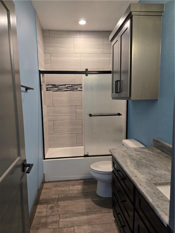 16125 Seagrape St, Corpus Christi, TX 78418 - bathroom featuring vanity, wood finished floors, washtub / shower combination, and recessed lighting