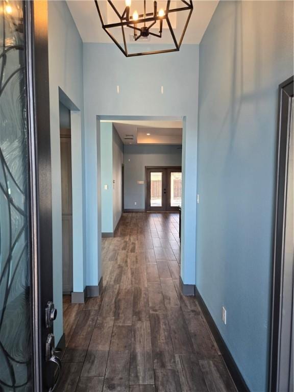 16125 Seagrape St, Corpus Christi, TX 78418 - hall featuring dark wood finished floors, a chandelier, and a towering ceiling