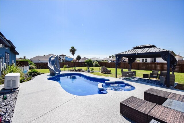 16125 Seagrape St, Corpus Christi, TX 78418 - view of pool with a water slide, a patio area, a gazebo, and a pool with connected hot tub