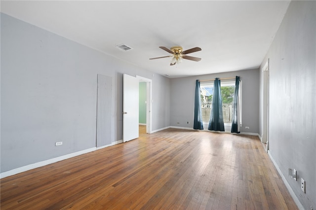 empty room featuring ceiling fan and light wood-type flooring