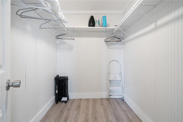 217 E Brundrett Ave, Port Aransas, TX 78373 - walk in closet featuring wood finished floors and radiator heating unit