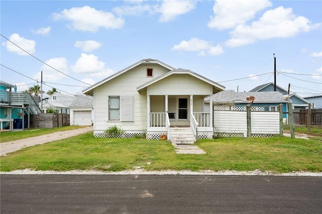 217 E Brundrett Ave, Port Aransas, TX 78373 - view of front facade with a porch and dirt driveway