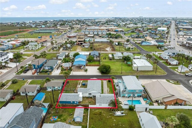 217 E Brundrett Ave, Port Aransas, TX 78373 - aerial view of residential area with property boundaries highlighted and a pool area