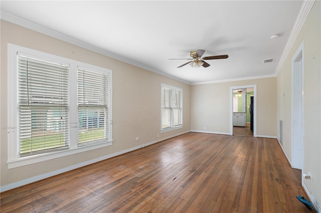 spare room with ceiling fan, ornamental molding, and dark wood-type flooring