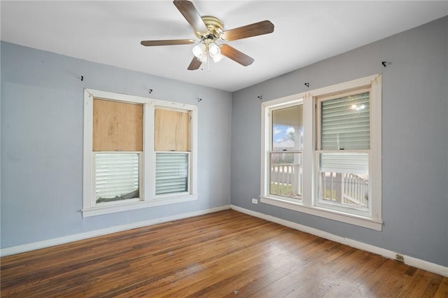 217 E Brundrett Ave, Port Aransas, TX 78373 - spare room with baseboards, hardwood / wood-style flooring, and ceiling fan