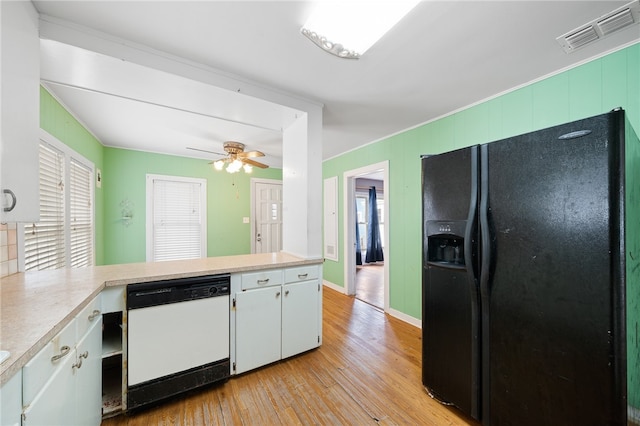 kitchen featuring white cabinetry, dishwasher, black refrigerator with ice dispenser, kitchen peninsula, and light hardwood / wood-style floors