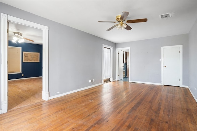 spare room with ceiling fan and light hardwood / wood-style floors