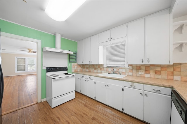 kitchen featuring white cabinets, white appliances, range hood, and sink