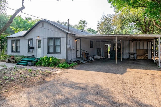 exterior space with a carport