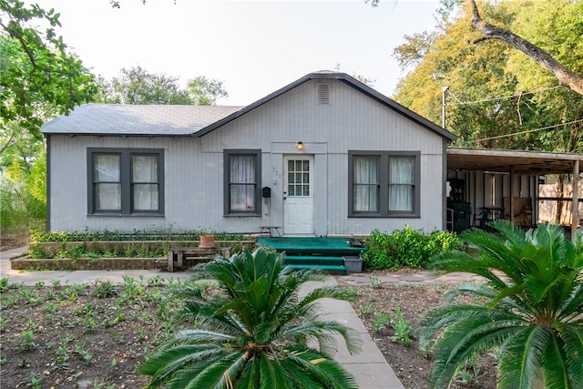 view of front of home with a carport