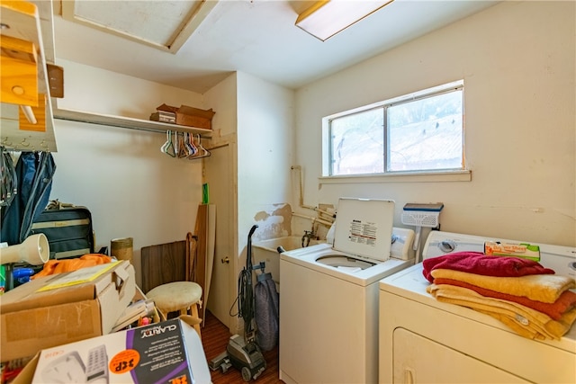 laundry area with separate washer and dryer and hardwood / wood-style floors