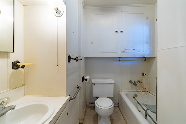 bathroom featuring toilet, a washtub, vanity, and tile patterned floors