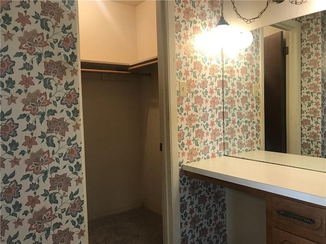 bathroom featuring wallpapered walls