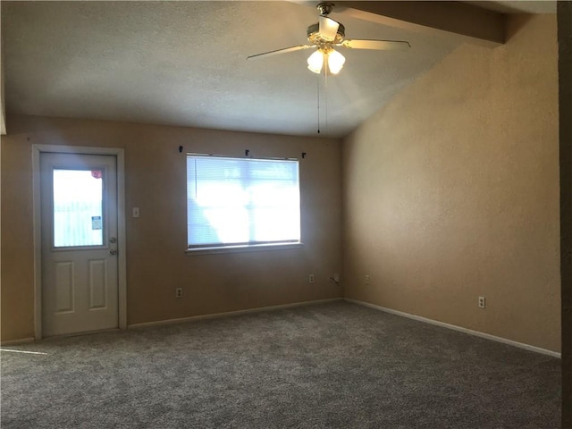 interior space with a healthy amount of sunlight, a textured ceiling, baseboards, and a ceiling fan