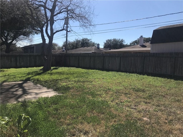 view of yard with a fenced backyard