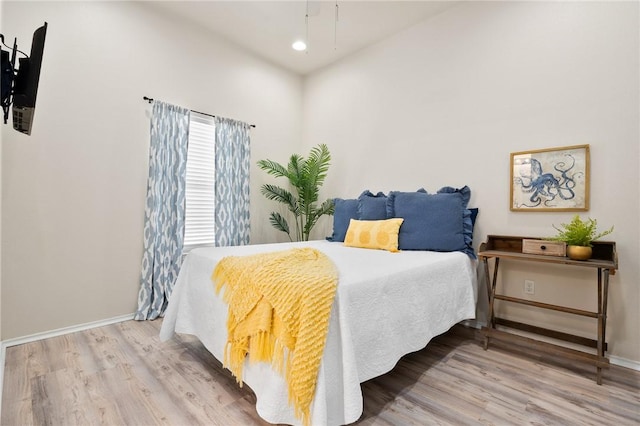 bedroom featuring recessed lighting, baseboards, and wood finished floors