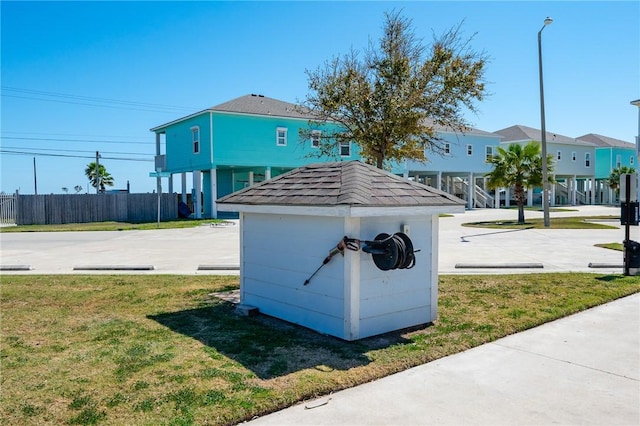 view of outdoor structure with fence