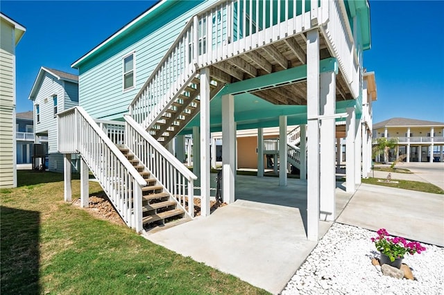 exterior space featuring a carport and a yard