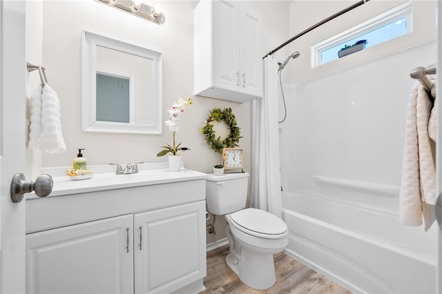 full bath with vanity, shower / bathtub combination with curtain, toilet, and wood finished floors