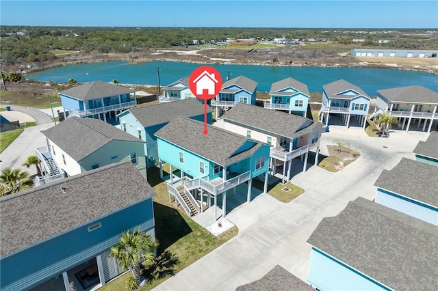 aerial view with a residential view and a water view