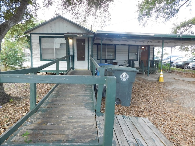 view of front of property with a carport