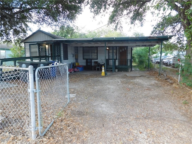 ranch-style home with a carport