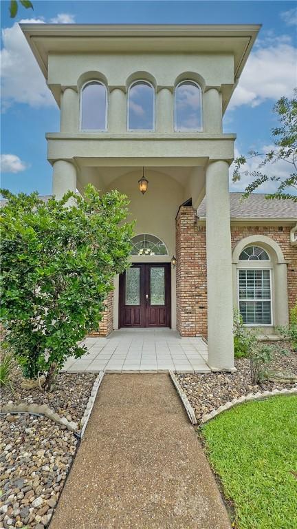 4 E Bar Le Doc Dr, Corpus Christi, TX 78414 - property entrance with brick siding and stucco siding
