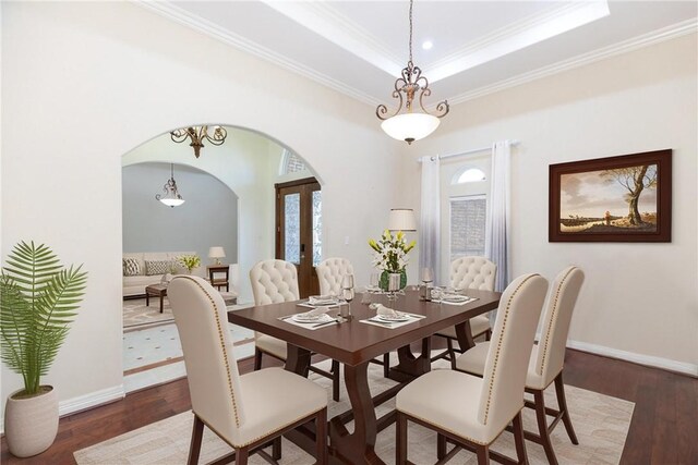 4 E Bar Le Doc Dr, Corpus Christi, TX 78414 - dining area with arched walkways, crown molding, wood finished floors, a tray ceiling, and french doors
