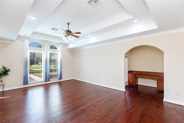 4 E Bar Le Doc Dr, Corpus Christi, TX 78414 - spare room featuring a tray ceiling, a ceiling fan, hardwood / wood-style floors, ornamental molding, and arched walkways