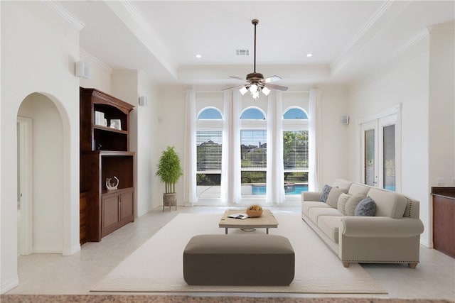 4 E Bar Le Doc Dr, Corpus Christi, TX 78414 - living area with a raised ceiling, light tile patterned floors, a ceiling fan, and crown molding