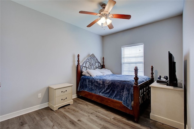 bedroom featuring light hardwood / wood-style flooring and ceiling fan