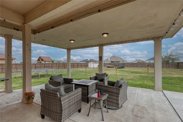 view of patio with a storage shed and a trampoline